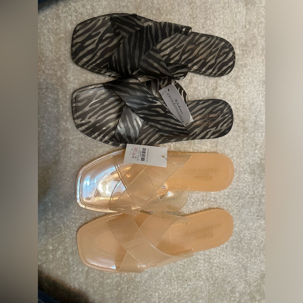 Anthropology criss cross jelly sandals in pink and black and white.